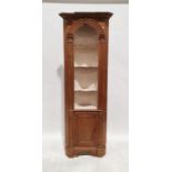 Modern pine corner unit with assorted shelves above cupboard door, on bracket feet, 200cm high