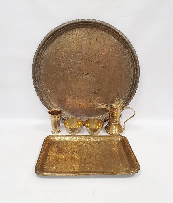 Middle Eastern brass tray, a dallah brass coffee pot, a pair of brass bowls, a vase and a large