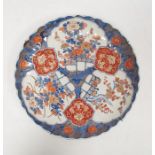 Imari fluted circular dish, 19th century, painted in gilt with flowering prunus, chrysanthemum and