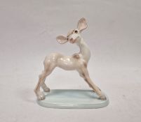 Wedgwood & Co mid- 20th century handpainted pottery fawn, on pale blue oval base, 15.5cm high