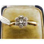 Gold and diamond flowerhead cluster ring set seven small stones, in case