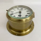 Brass cased ships bulkhead clock, circa early-mid 20th century, with enamelled white dial and