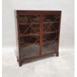 20th century display cabinet in mahogany, with astragal-glazed doors enclosing shelves, to bracket