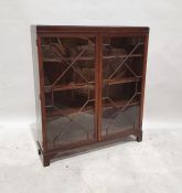 20th century display cabinet in mahogany, with astragal-glazed doors enclosing shelves, to bracket