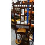 Late Victorian mahogany hall stand with mirrored back, lift-top glove box incorporating umbrella and