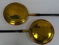 Two copper and brass bed warming pans, one marked 'The Children of Newnton School request their kind