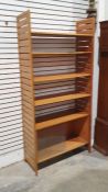 Mid-century modern teak Ladderax-style shelving system with four shelves and unit with sliding glass