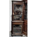 20th century corner display cabinet, the moulded cornice above astragal-glazed door enclosing