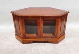 Television stand with two glazed doors, on bracket feet