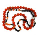 Chinese cinnabar lacquer carved bead necklace and a black and rose agate bead necklace interpersed