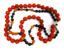 Chinese cinnabar lacquer carved bead necklace and a black and rose agate bead necklace interpersed