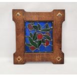 Arts and Crafts style oak mounted stained glass panel, the leaded glass panel decorated with green