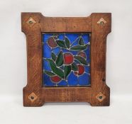 Arts and Crafts style oak mounted stained glass panel, the leaded glass panel decorated with green