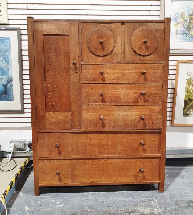 Early 20th century Heal & Son oak compactum, the wardrobe door to the left hand side above two