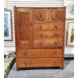 Early 20th century Heal & Son oak compactum, the wardrobe door to the left hand side above two