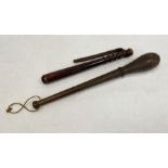 Carved wooden truncheon and another, 50cm and 39cm (2)