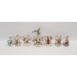 Seven early 20th century Italian Capodimonte porcelain figures of putti at various pursuits, painted