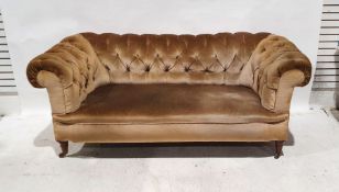 Late Victorian Chesterfield-style sofa in brown upholstery, raised on castors Condition
