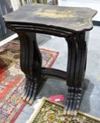 Quartetto nest of four 1920's lacquered tables, the shaped tops with gold-coloured Eastern scenes,