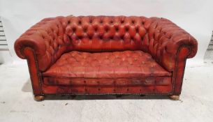 Chesterfield sofa in red leather button-back upholstery, squat bun feet