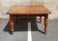 Victorian mahogany extending dining table, the rectangular top with rounded front corners, two