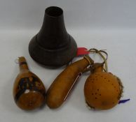 Three African gourd water pots, one featuring a painetd savannah scene, the other decorated with dot