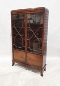 Early 20th century mahogany cabinet, the astragal-glazed doors on splayed supports, 176cm x 104cm