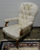 Victorian armchair with white upholstered seat, back and arm rests, on shaped legs to brown china