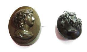 Carved jet pendant locket, oval with classical profile in relief and a bois durci classical female