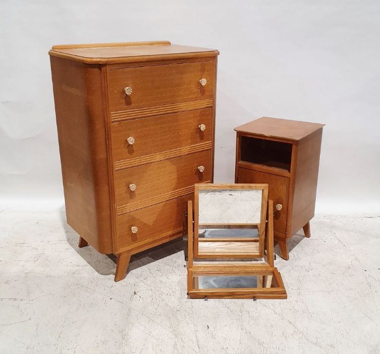 20th century oak chest of four long drawers, a matching dressing table and a three-part oak framed
