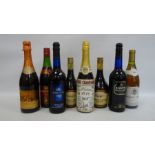 Eight bottles of assorted wines and liqueurs including Harvey's Bristol Cream sherry, Guernsey Cream