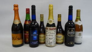 Eight bottles of assorted wines and liqueurs including Harvey's Bristol Cream sherry, Guernsey Cream