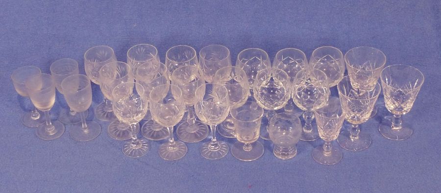 Set of 10 cut glass sherry glasses, a large quantity of cut glass drinking glasses, vases, bowls,