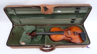 Violin, in case, the pine top with scrolled sound holes, paper label inside 'Antonios Stradavarius