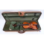 Violin, in case, the pine top with scrolled sound holes, paper label inside 'Antonios Stradavarius