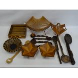 Two treen bowls of octagonal form on three tapering triangular legs, two folding baskets, assorted