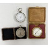 Three pocket barometers including a German aneroid barometer in chrome case 5cm diam., a desk