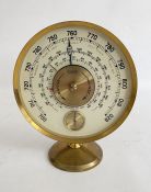 Mid-20th century Jaeger desk barometer, in gilt metal case of circular form with cream coloured
