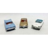 Three loose Corgi Toys diecast model cars to include No.245 Buick Riviera, No. 220 Chevrolet