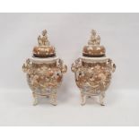 Pair of Japanese Satsuma vases and domed covers, early 20th century, painted in gilt with flowers
