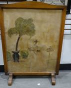 20th century oak-framed firescreen with painted decoration, 77cm high x 56cm wide