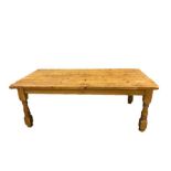 Pine kitchen table, the rectangular plank top on turned and block supports, squat and bun feet, 79cm