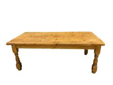 Pine kitchen table, the rectangular plank top on turned and block supports, squat and bun feet, 79cm