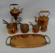 Arts & Crafts-style copper tray with brass handles, a copper teapot, graduated saucepans with iron