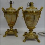 Pair of marble and gilt bronze table lamps, the two-handled vase shaped bodies ornately decorated in