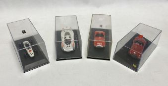 Four cased diecast model cars to include Norev Honda F1 RA 272, Ebbro 740 Porsche 908 Long Tail Le