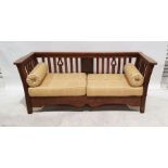 Arts & Crafts oak three-piece suite comprising twin-seat settee and pair of armchairs, the settee of