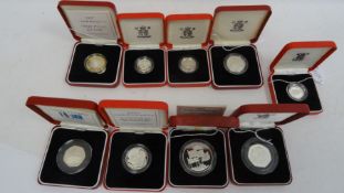 Nine assorted silver proof coins to include 1992-1993 50p coin, 1983 £1 coin, 1996 silver proof
