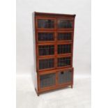 20th century Minty mahogany and satinwood crossbanded sectional bookcase with leaded glazed doors,