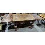 20th century oak dining table in the Jacobean taste, the rectangular top with draw leaves, on cup